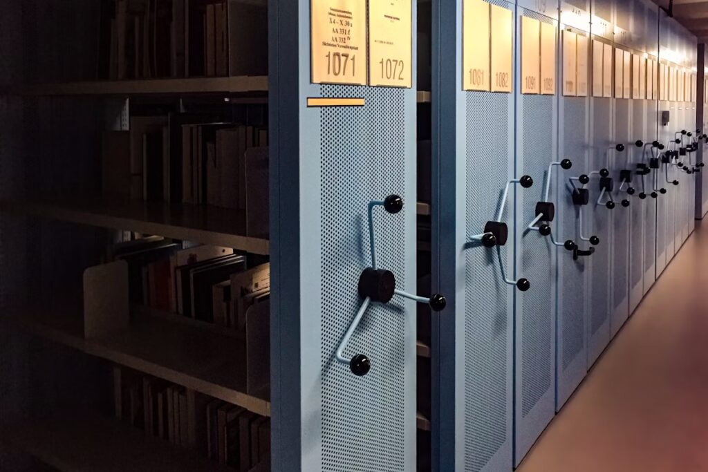 decor - grey movable archive shelves representing AMS data admnistration and MDM